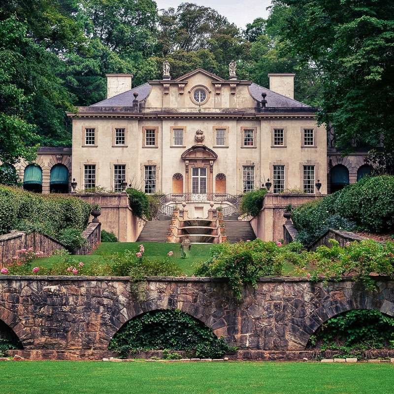 Swan House Atlanta view of back with dual stair case, and lush landscaping